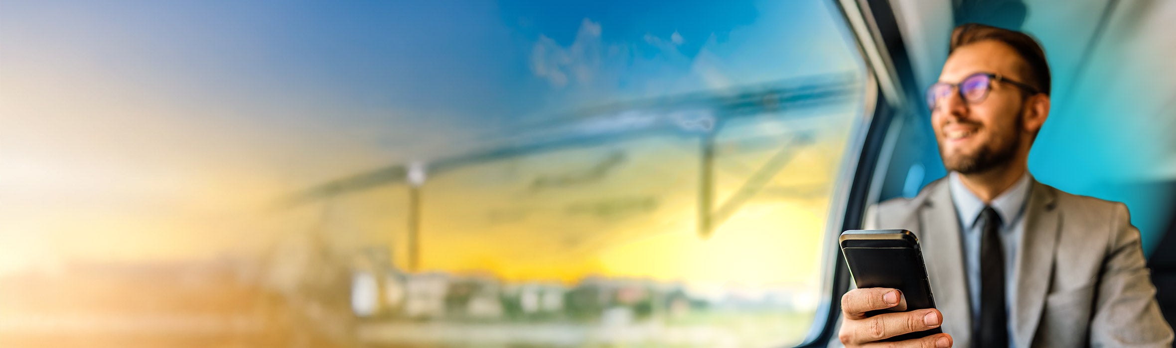 Caucasian businessman wearing glasses traveling in a car looking out of the window with a phone in his hand and a blue gradient hovering around him 