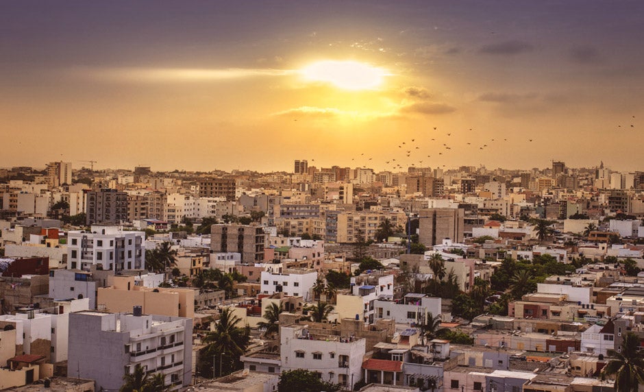 Sunset overlooking buildings in a city 